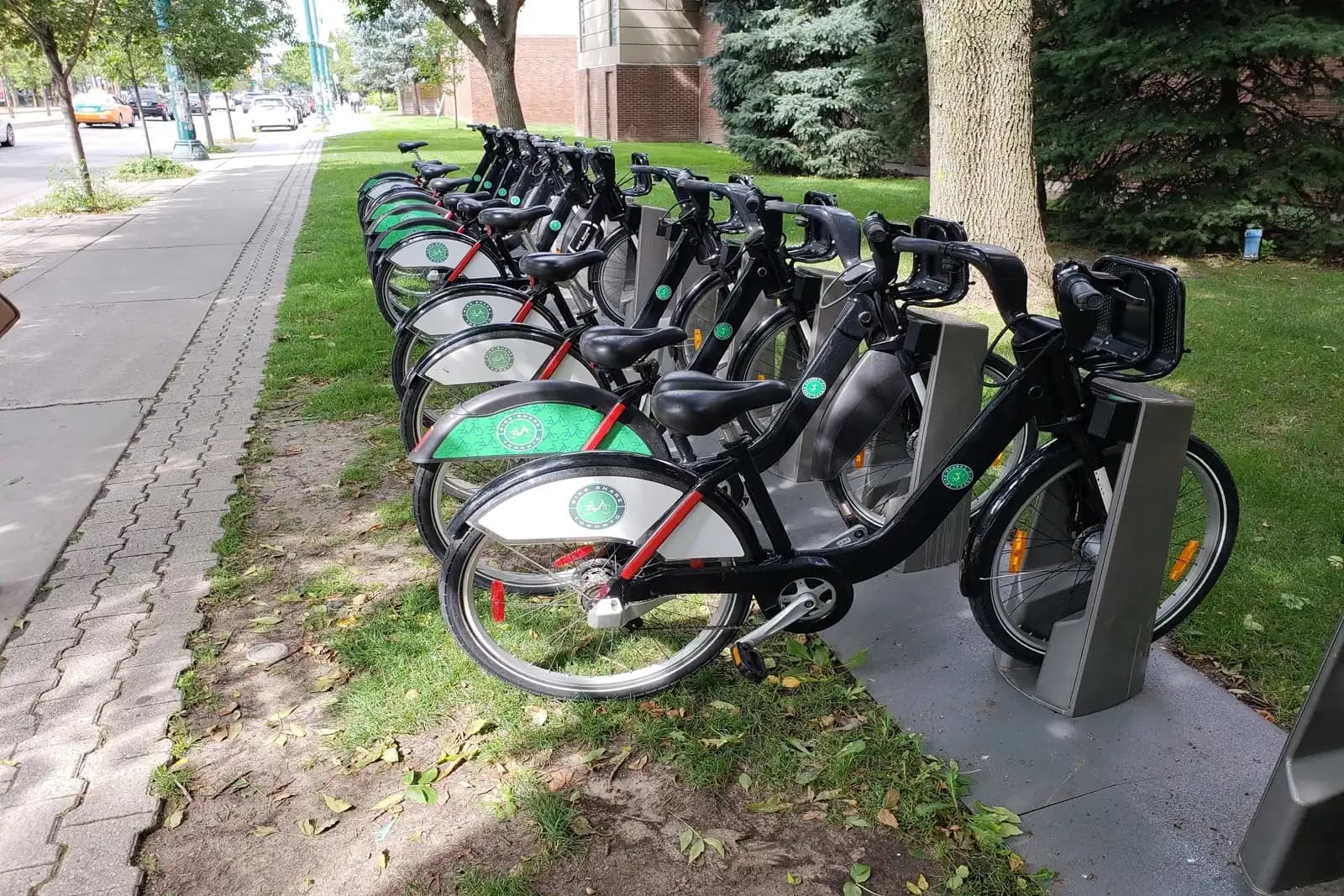 Municipal bike-share docking station with bicycles on a city sidewalk in Canada