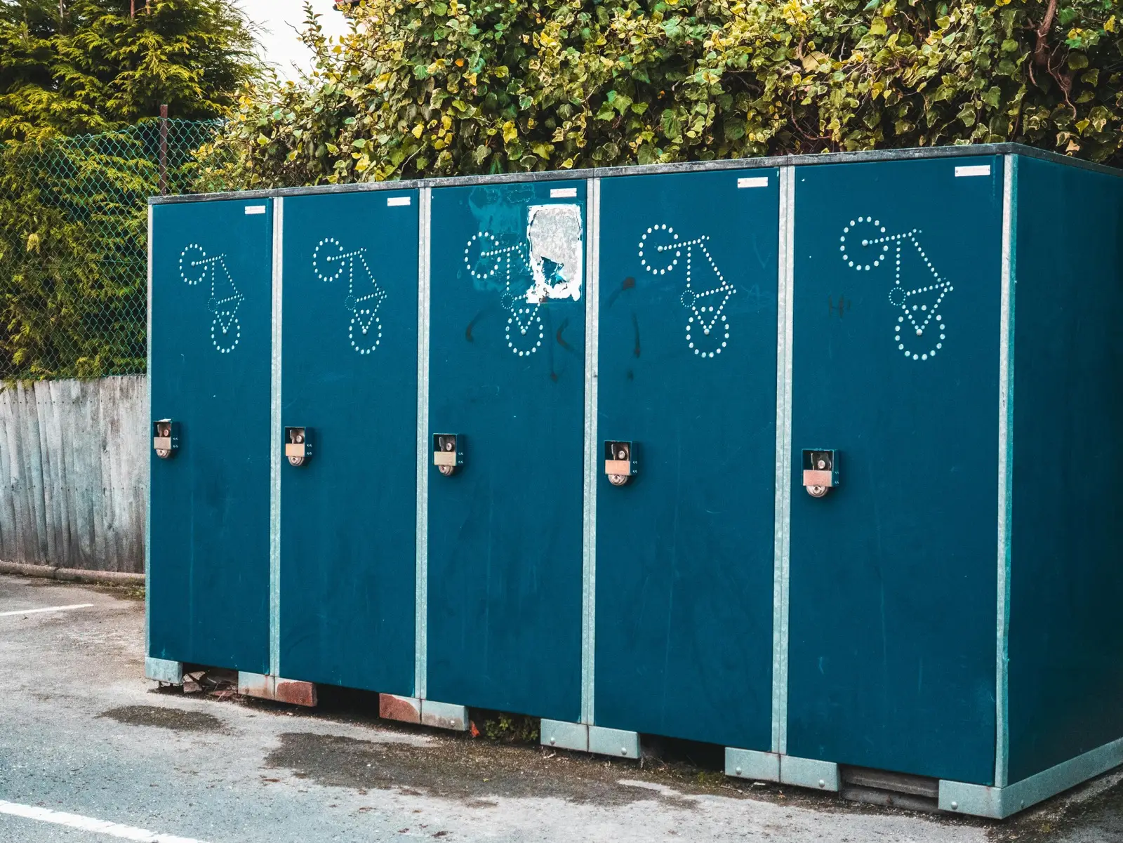 Galvanized steel outdoor bike lockers and racks engineered for Canadian winter conditions including road salt and freeze-thaw cycles